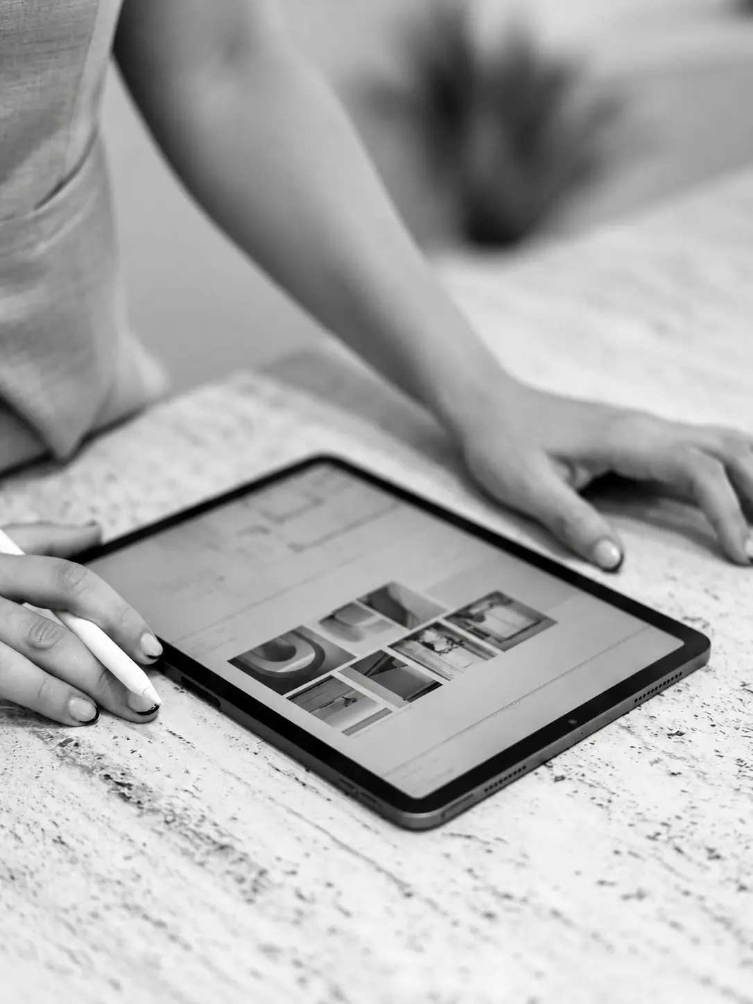 Finish selections reviewed on a tablet on a marble counter